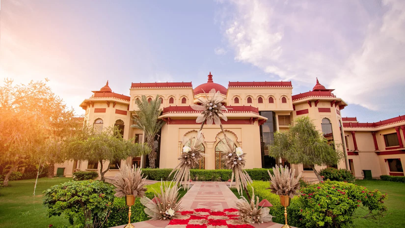 The Ummed Jodhpur palace-style resort facade with carved sandstone domes and jharokhas at the edge of the Thar in Jodhpur