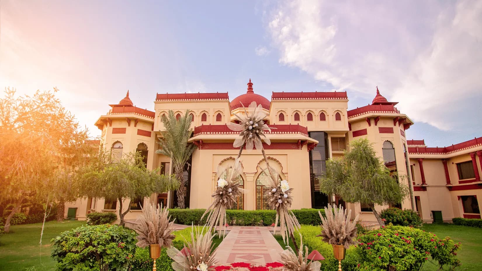 Carved sandstone facade, jharokhas and domes of The Ummed Jodhpur palace-style resort