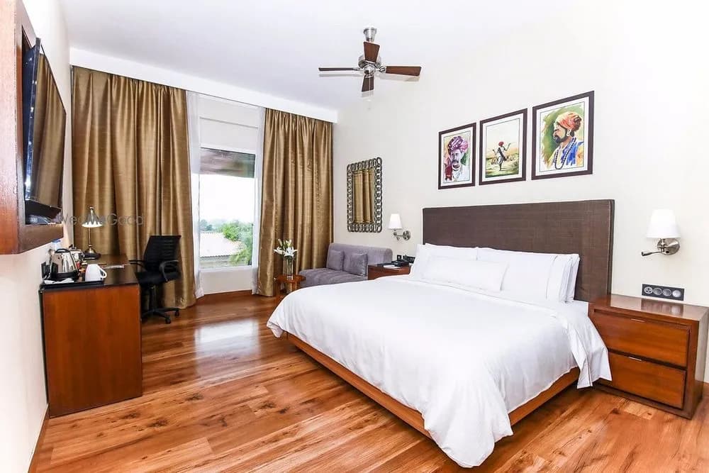 Spacious deluxe villa guest room with Rajasthani folk artwork and Aravalli view at The Westin Pushkar Resort & Spa