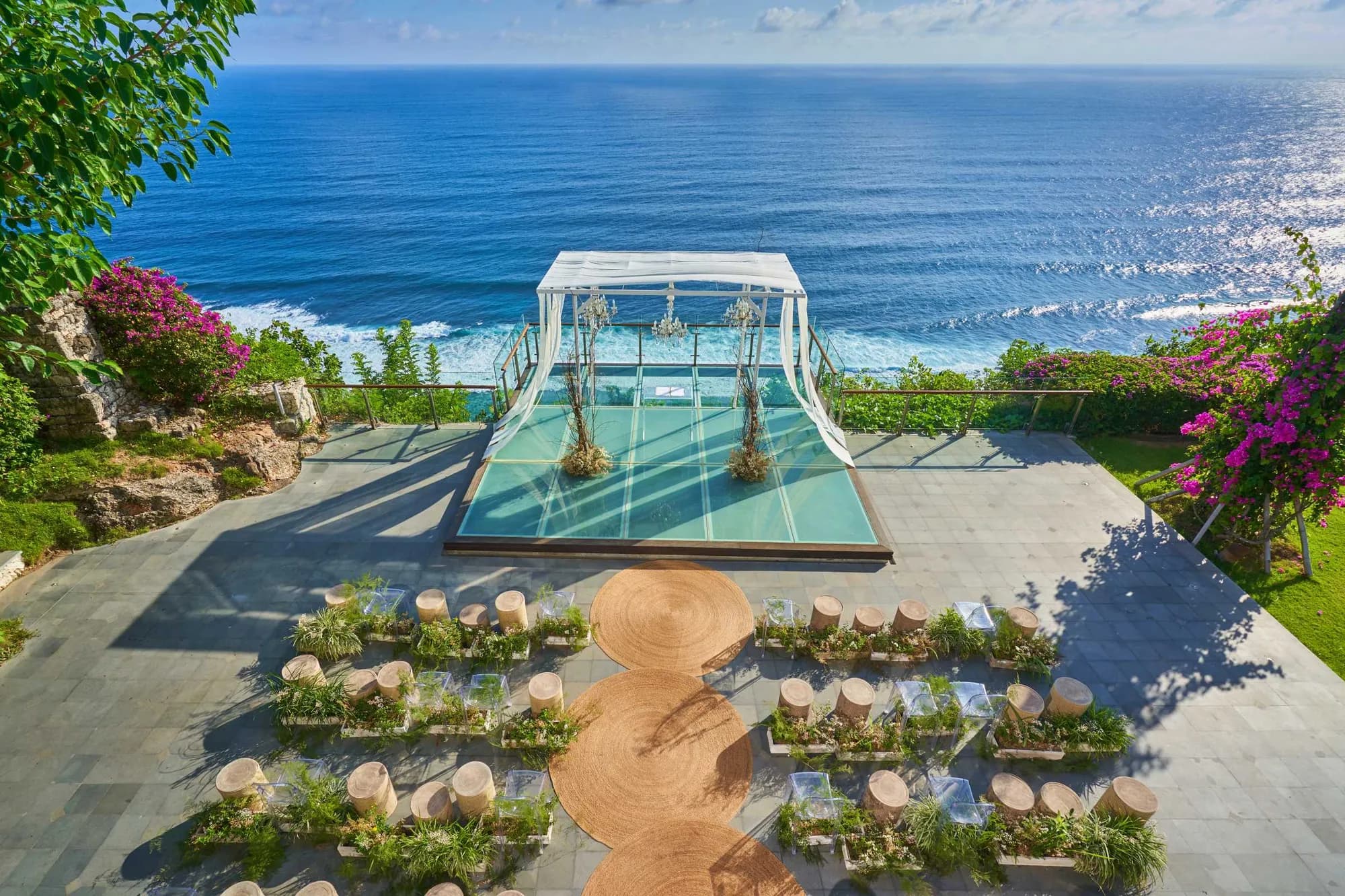 Transparent Glass Stage clifftop ceremony platform above the Indian Ocean at Tirtha Uluwatu, Bali