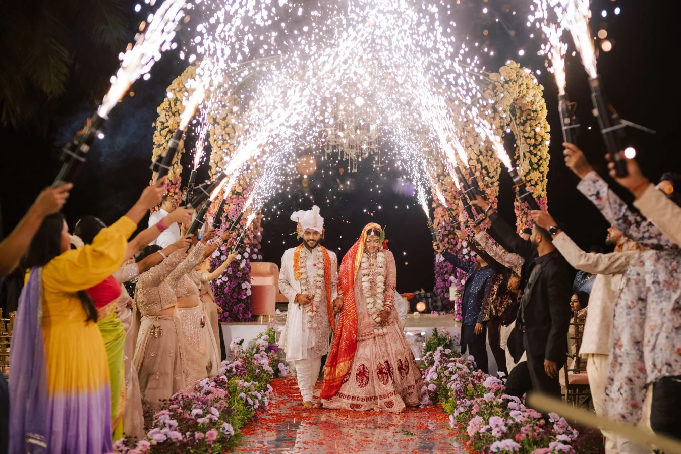 Couple's sparkler entrance at a wedding celebration