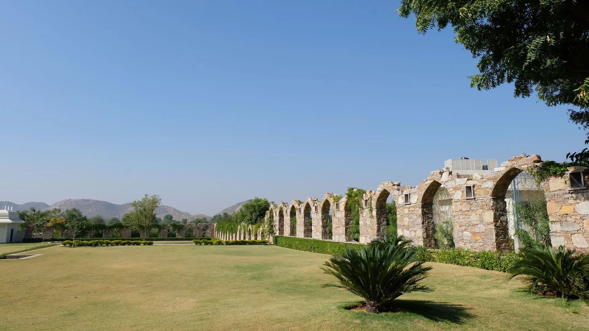 Outdoor lawn wedding setting at a Rajasthan heritage property