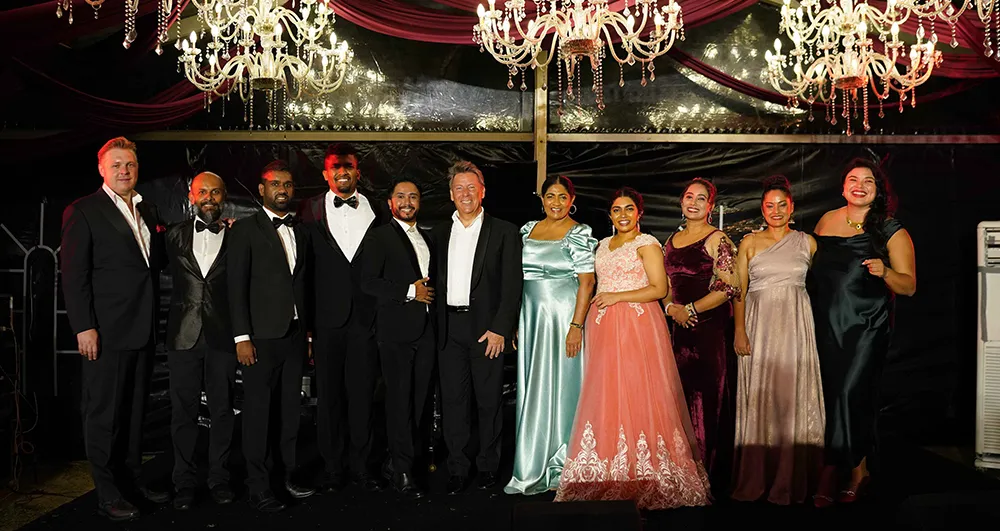 Crimson-draped marquee with chandeliers set for an evening celebration at Anantara Peace Haven Tangalle Sri Lanka