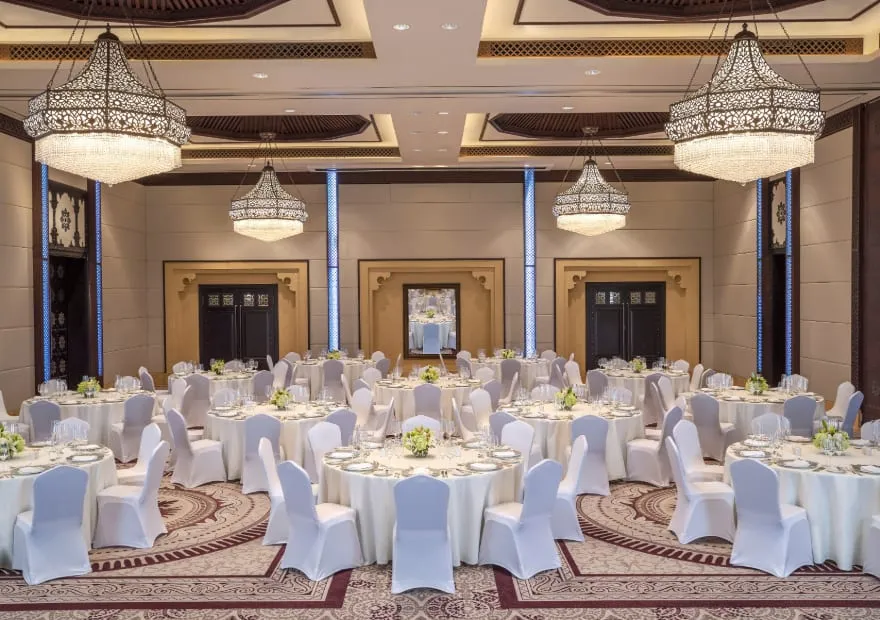 Liwa Ballroom set for a gala dinner with Arabian chandeliers at Anantara Qasr Al Sarab, Abu Dhabi
