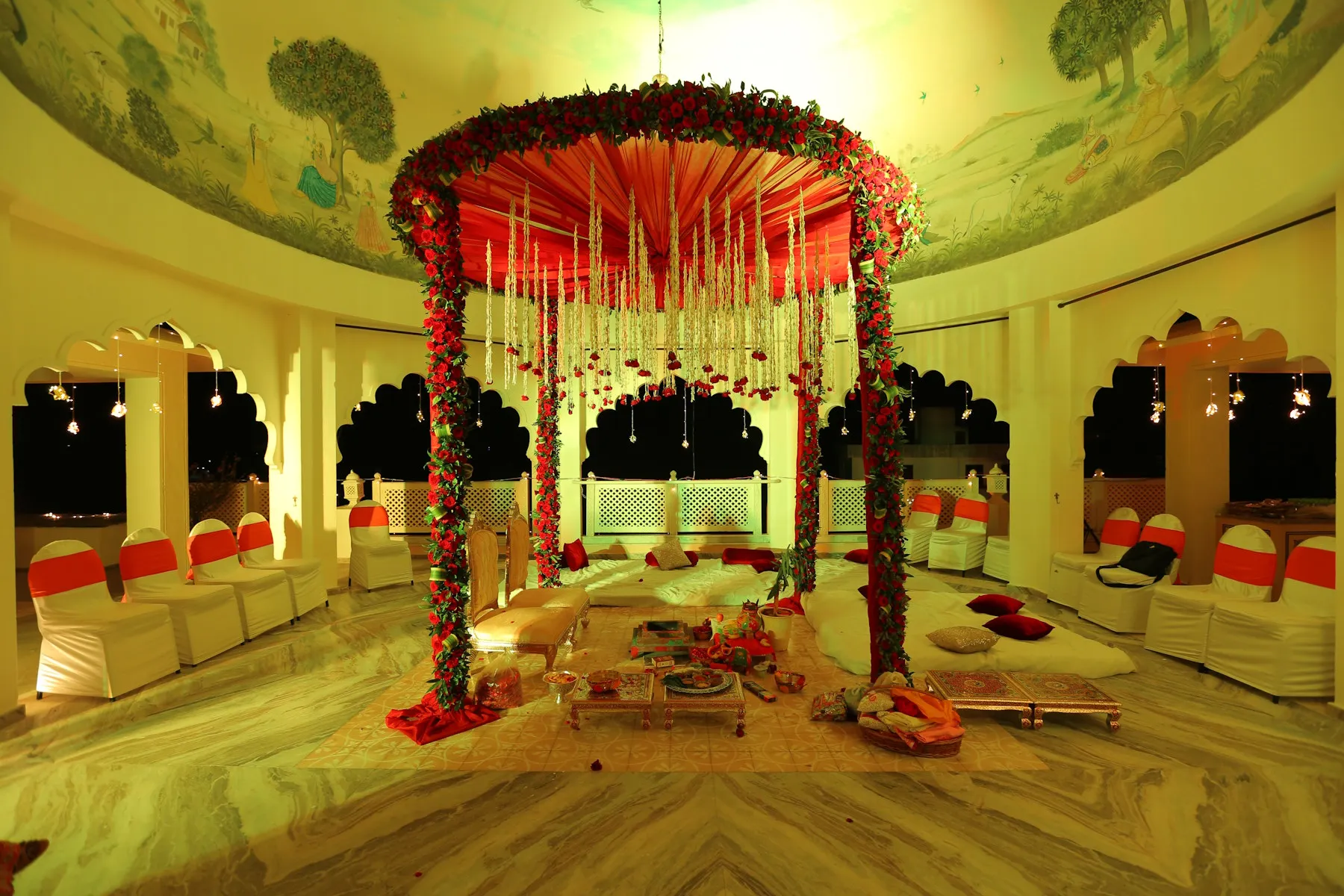 Open banquet lawn set for a wedding celebration against the white haveli at Anuraga Palace Ranthambore