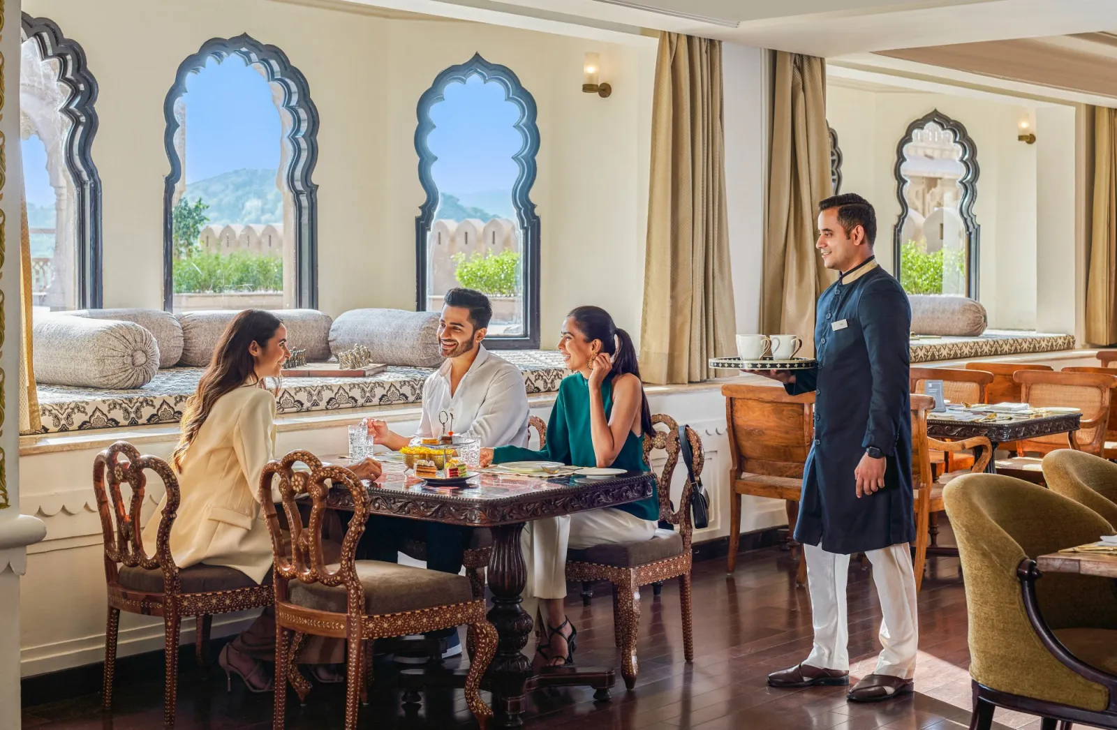 Luxury suite with hand-painted murals and Rajasthani detail at Fairmont Jaipur