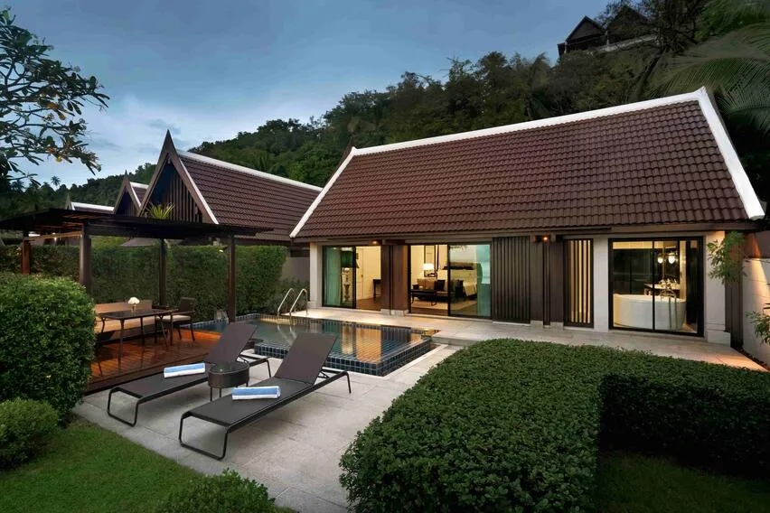 InterContinental Koh Samui Resort tiered hillside and private beach glowing at golden hour over the Gulf of Thailand, Taling Ngam