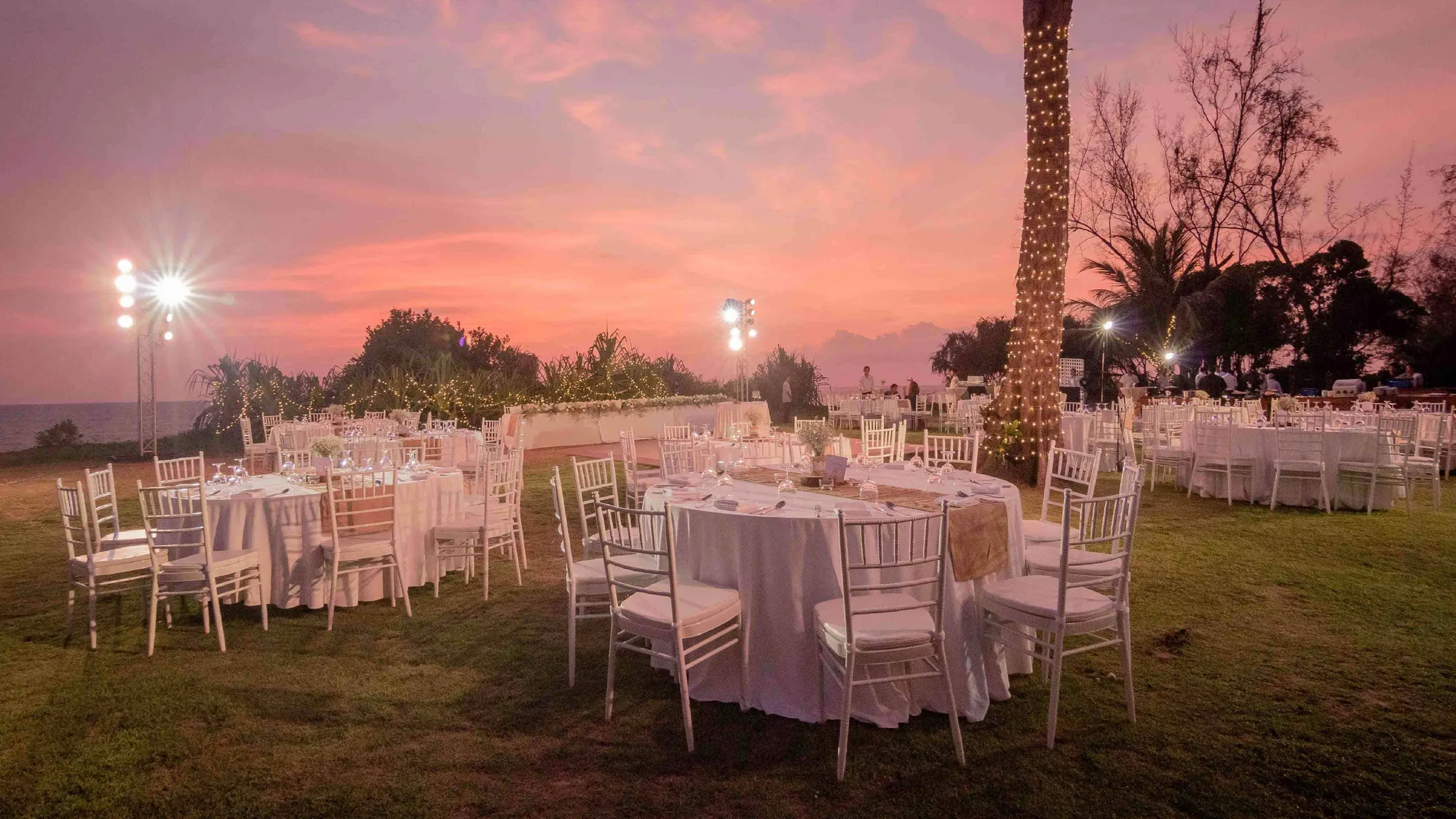 Al-fresco beachfront event and dinner setup at dusk at JW Marriott Phuket Resort & Spa, Mai Khao