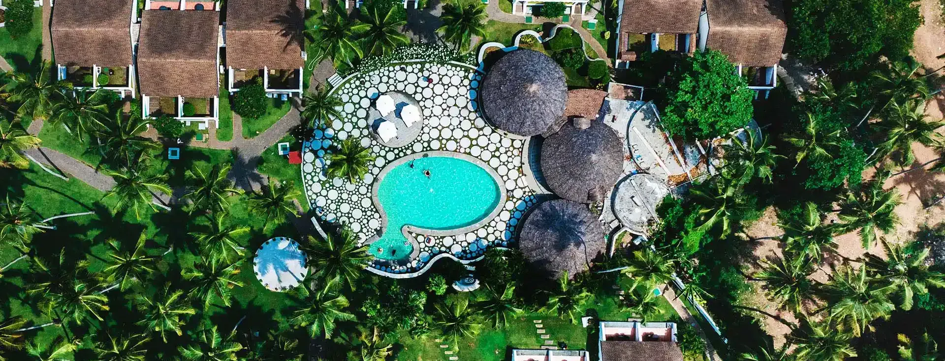 The Club pool and villas at The Leela Kovalam
