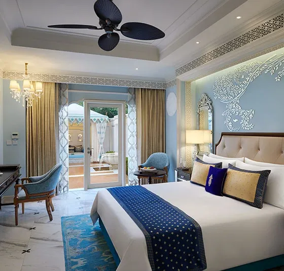 Carved jaali screens, archways and Rajput-Mughal architectural detail at The Leela Palace Jaipur