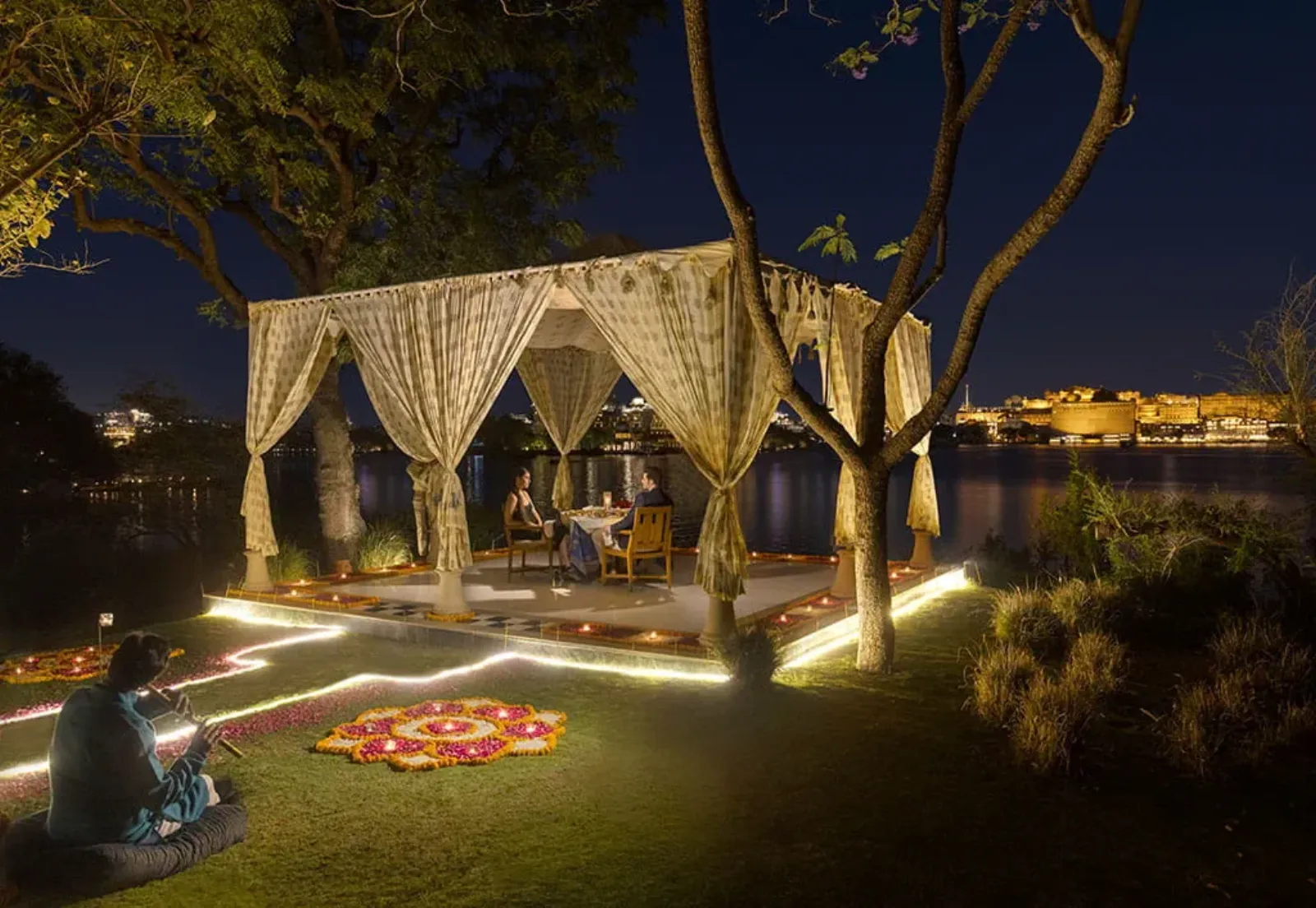 Crescent garden lakefront ceremony and mandap setting at The Oberoi Udaivilas Udaipur