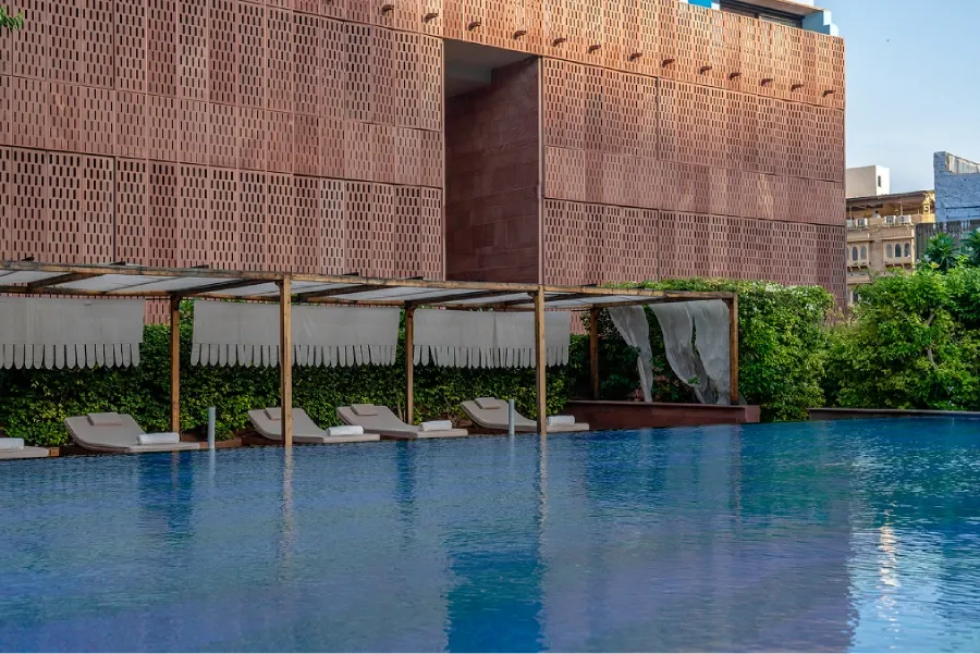 Luxury room with stone-carved detail and direct Mehrangarh Fort view at RAAS Jodhpur