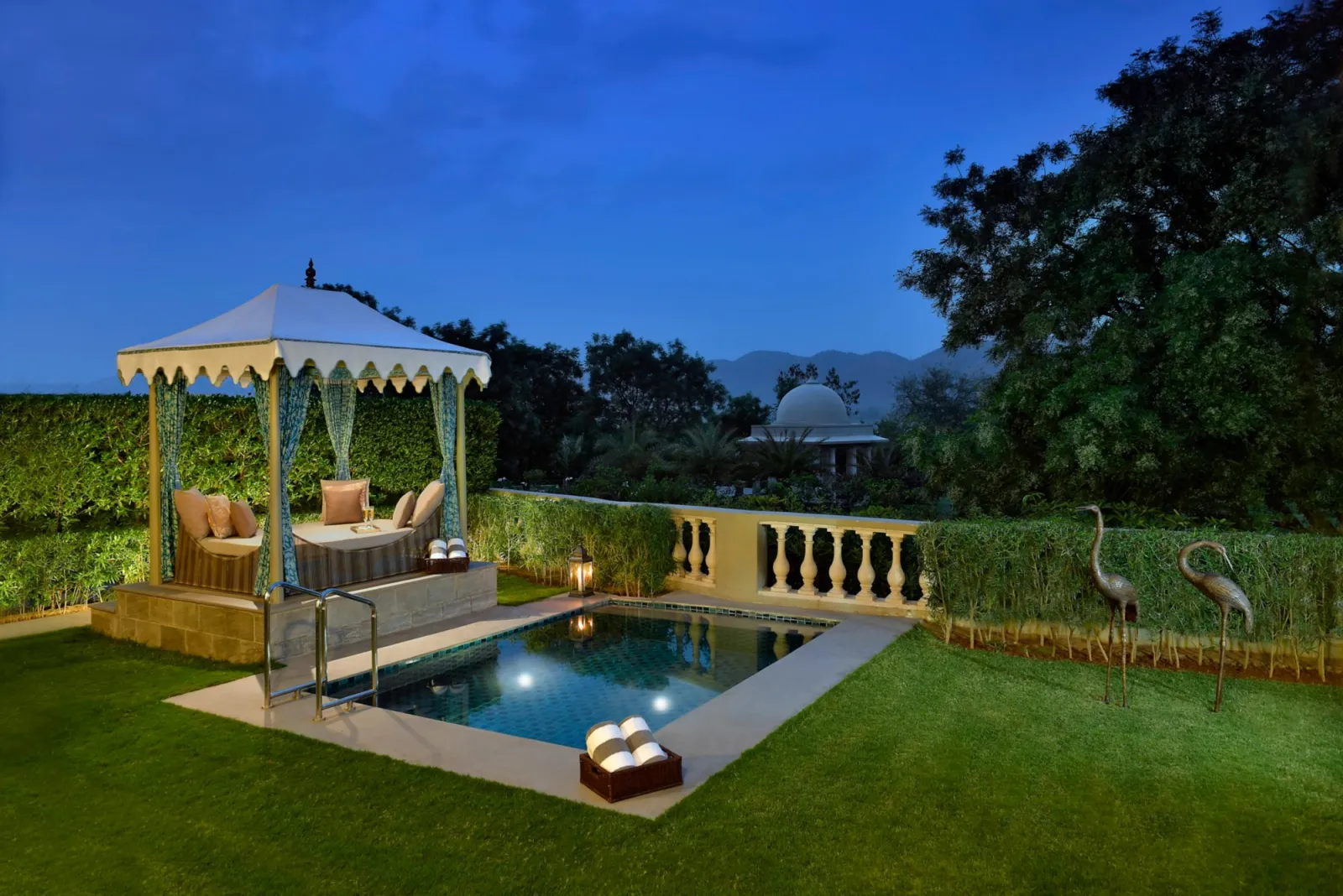Luxury suite with lake views and handcrafted furnishings at Raffles Udaipur