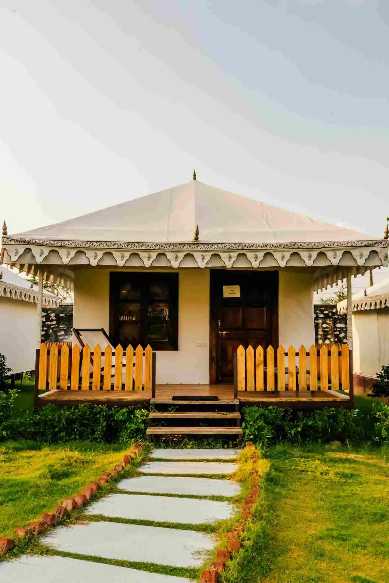 Luxury tent canvas, wooden furnishing and lantern decor detail at Rawai Luxury Tents Pushkar