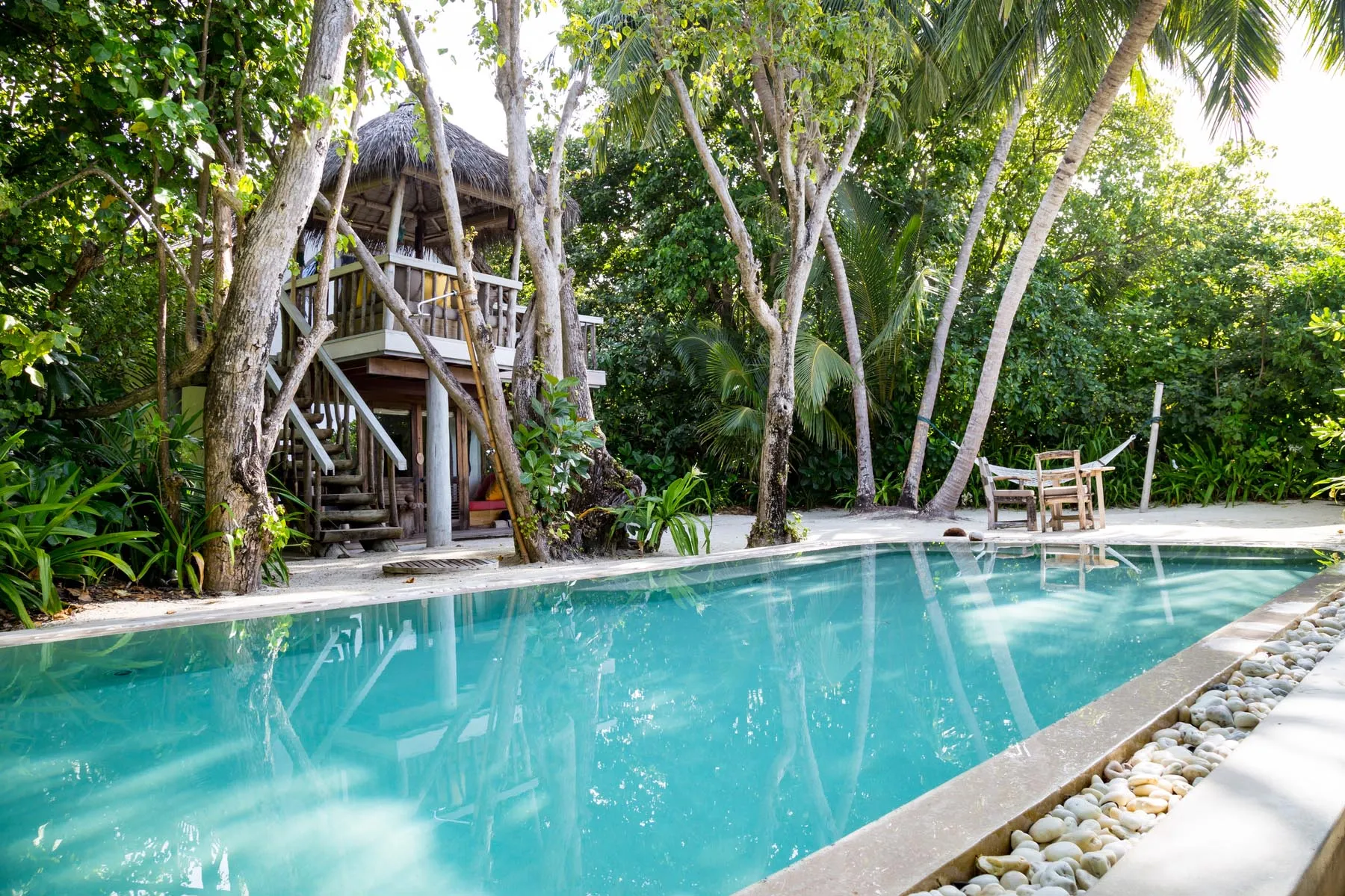 Crusoe pool villa with private pool among tropical jungle at Soneva Fushi Maldives