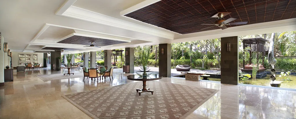 Open Balinese-roofed Astor Ballroom pre-function area with reflecting pool and gardens at The St. Regis Bali Resort, Nusa Dua
