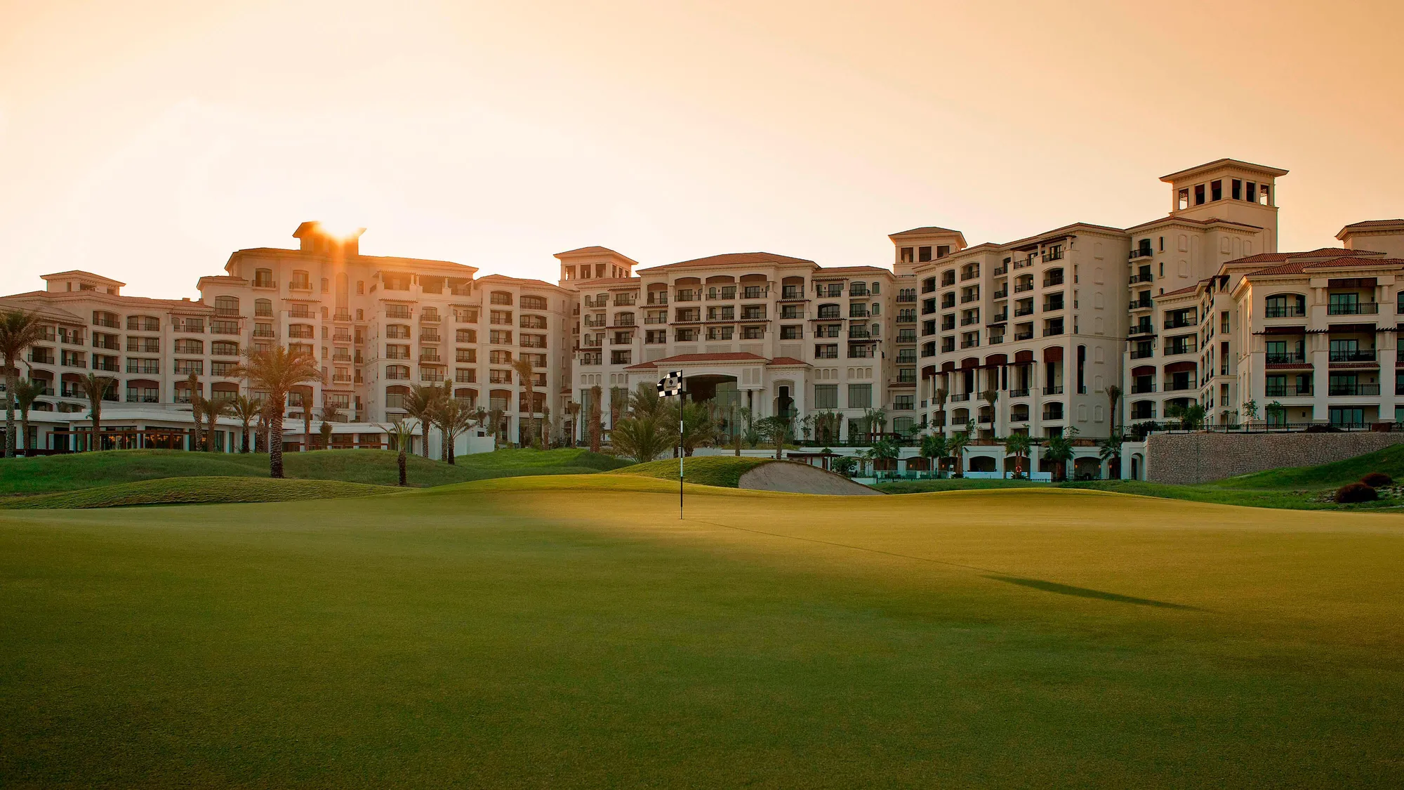 Mediterranean-style architecture of The St. Regis Saadiyat Island Resort above the white-sand beach and Arabian Gulf, Abu Dhabi