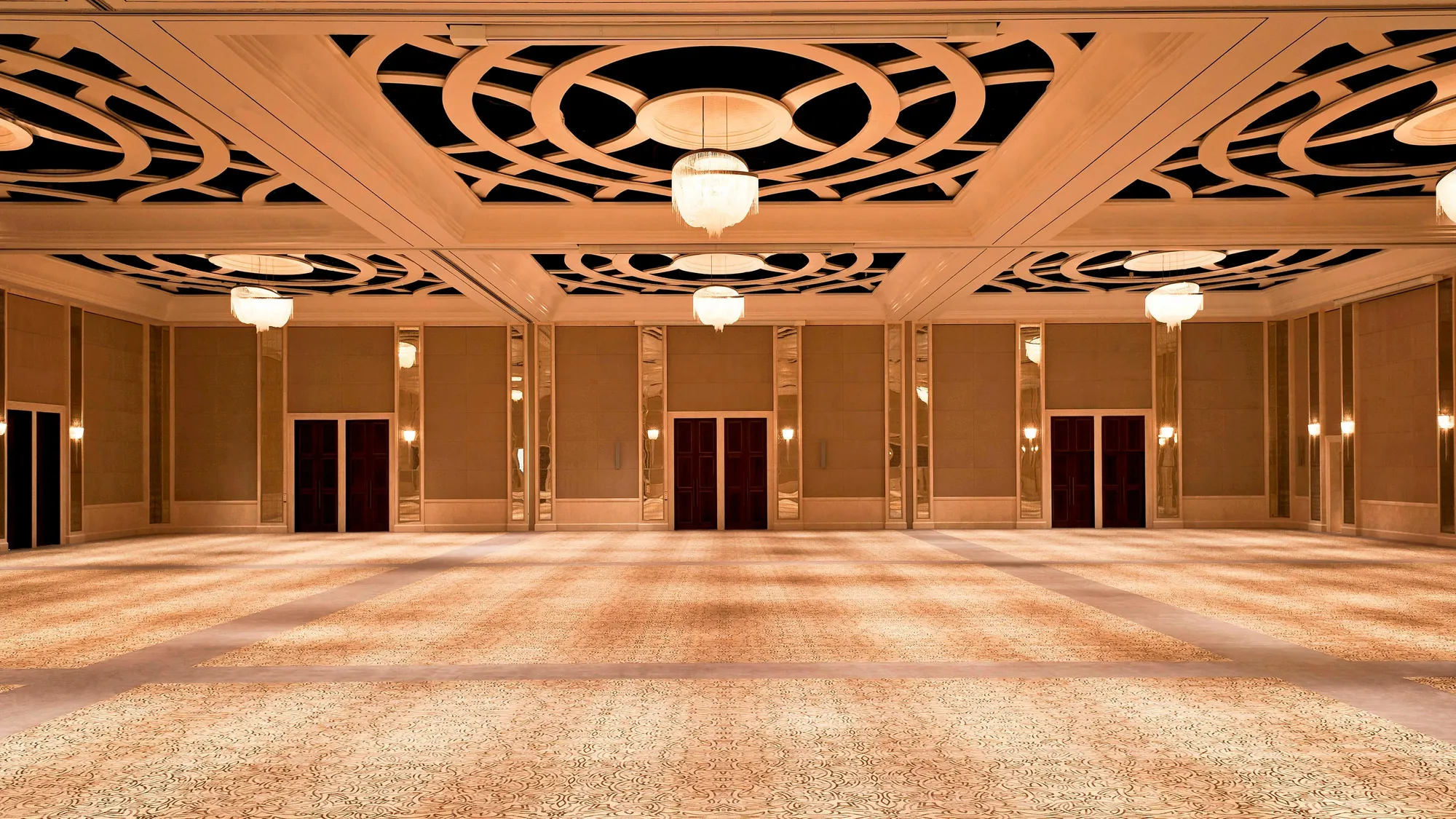 Regal Ballroom dressed for a wedding reception with chandeliers at The St. Regis Saadiyat Island Resort, Abu Dhabi