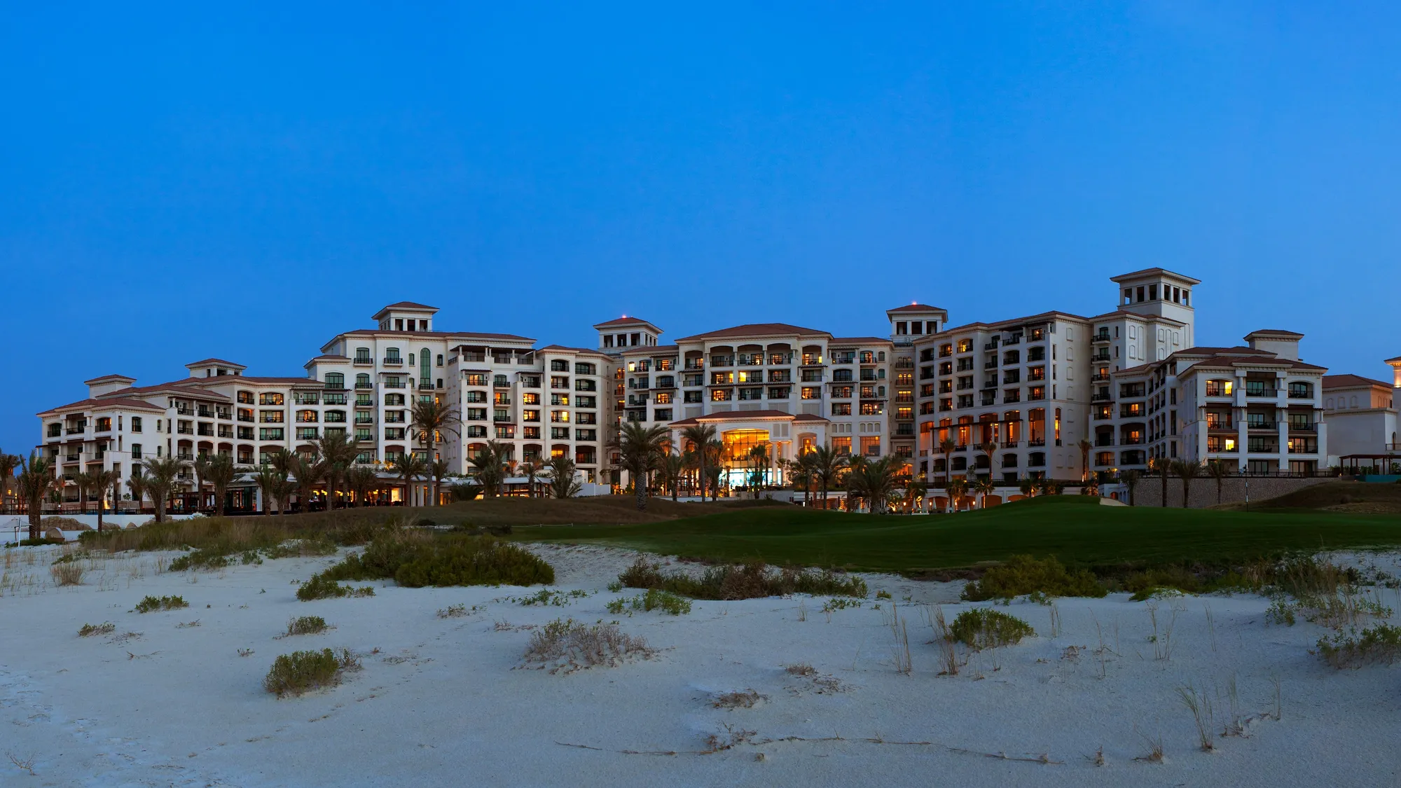 The St. Regis Saadiyat Island Resort illuminated against the Arabian Gulf at night, Abu Dhabi