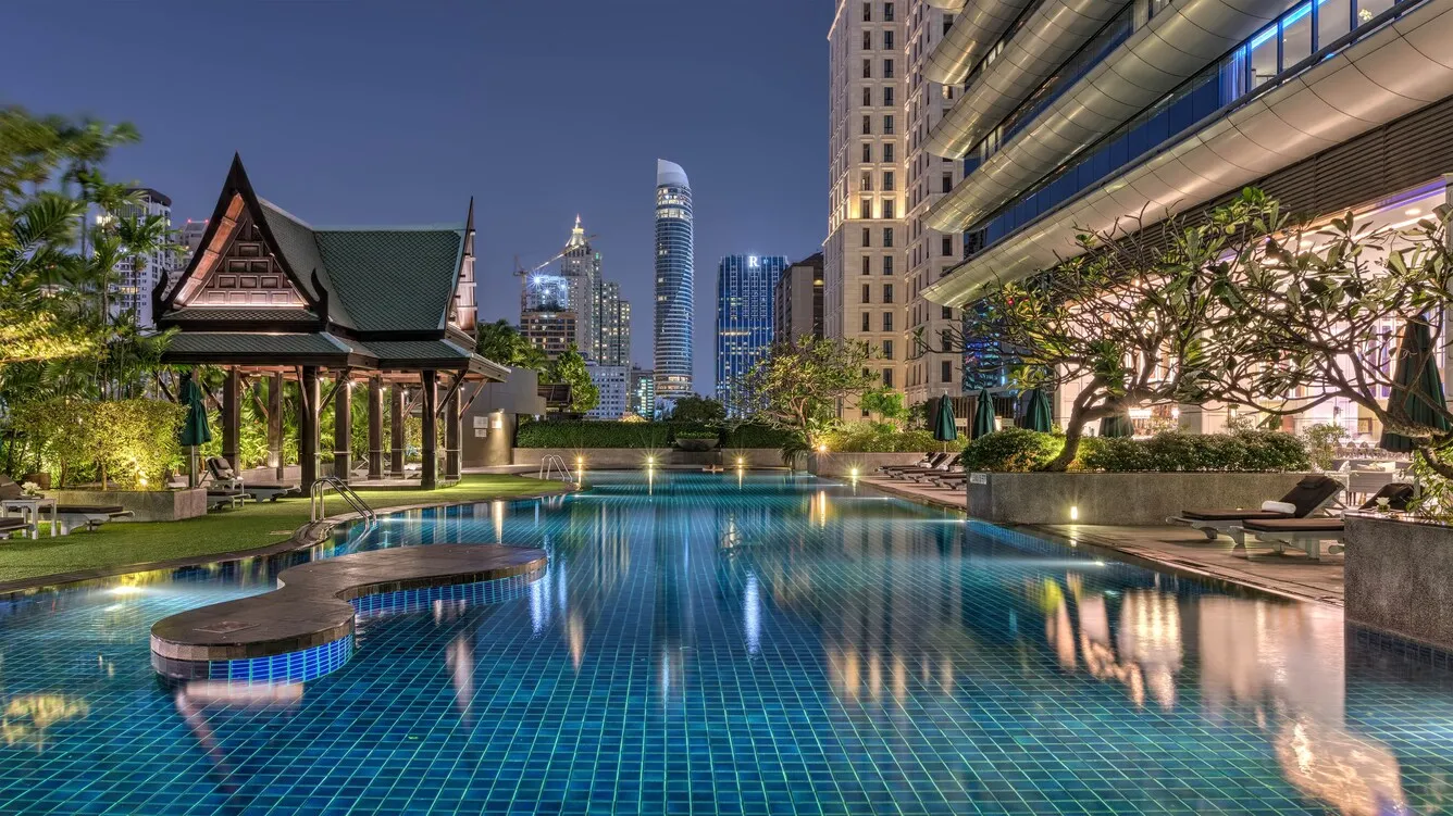 Rooftop sky garden and swimming-pool deck with city views at The Athenee Hotel Bangkok