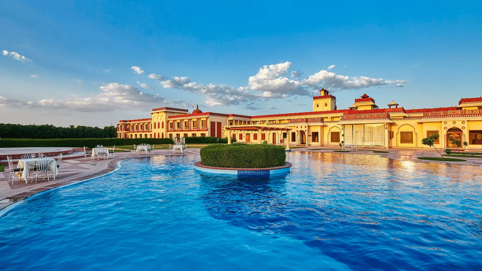 Poolside lawn and central sandstone courtyard at The Ummed Jodhpur