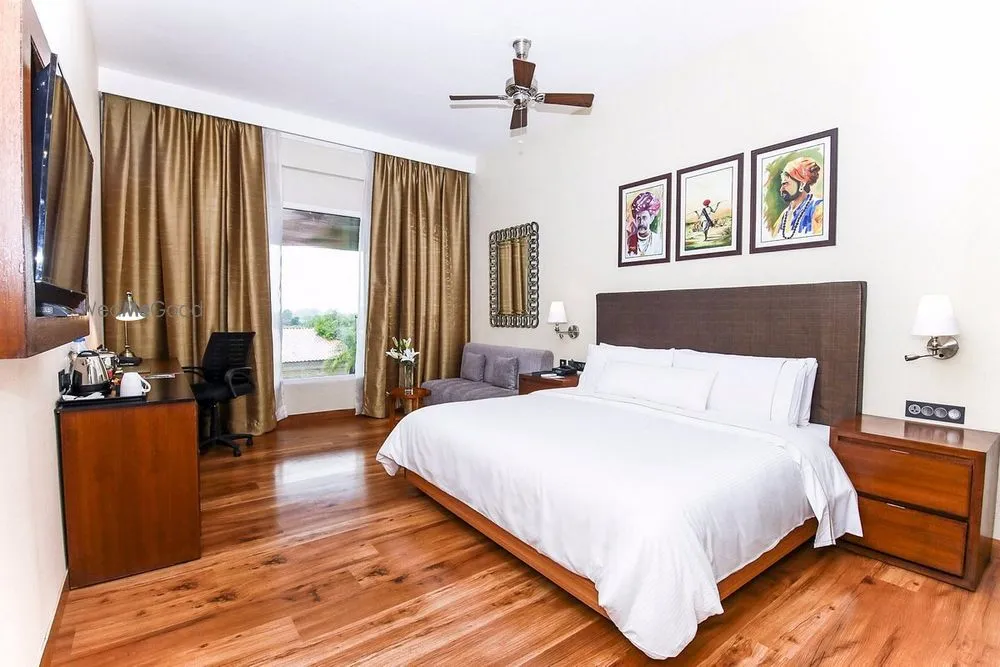 Spacious deluxe villa guest room with Rajasthani folk artwork and Aravalli view at The Westin Pushkar Resort & Spa