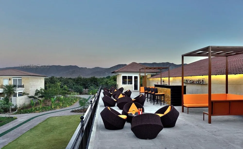 Panorama rooftop lounge and bar with seating and Aravalli hill views at dusk, The Westin Pushkar Resort & Spa